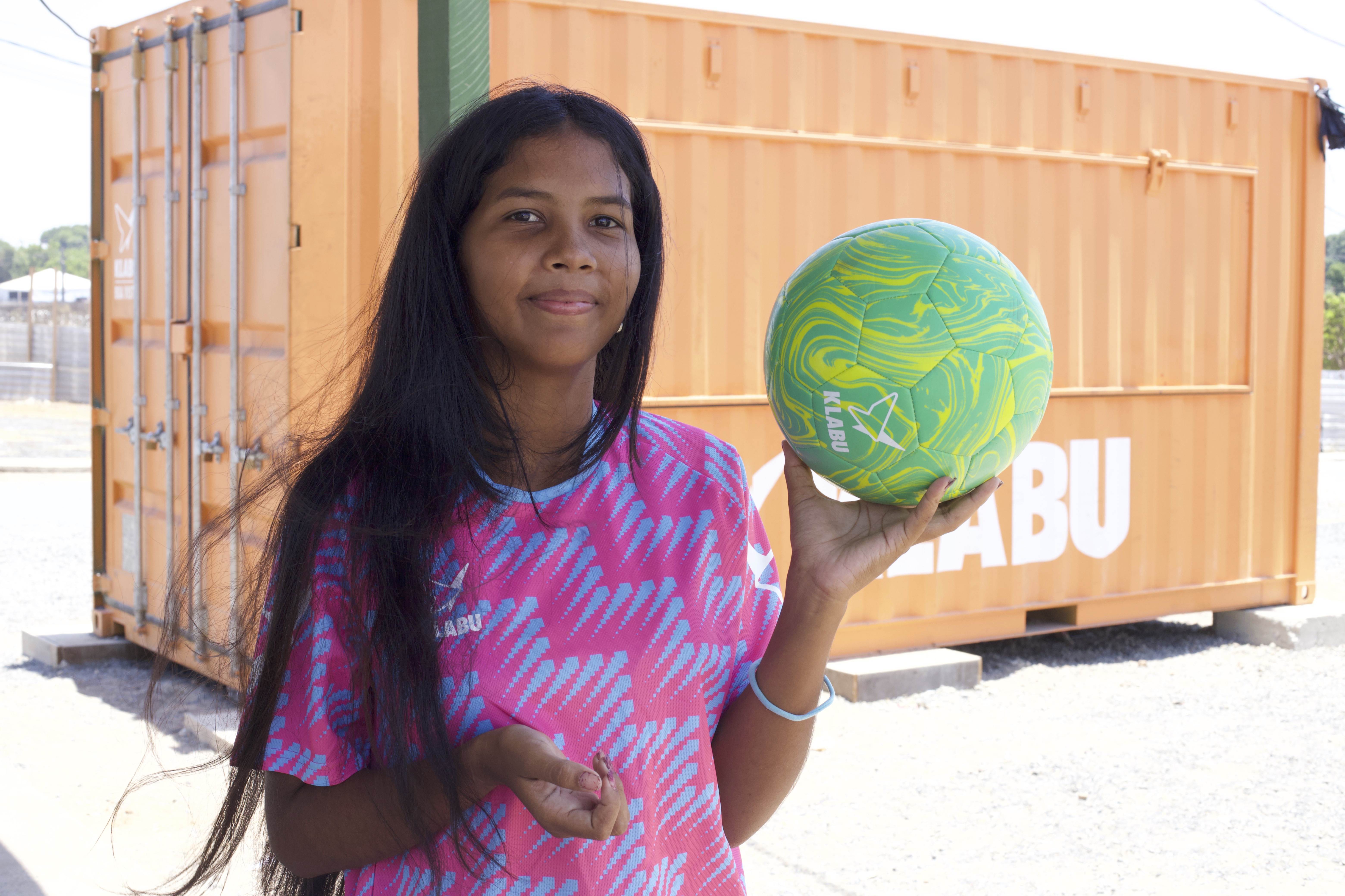 Portrait of Divennys in front of Boa Vista KLABU clubhouse