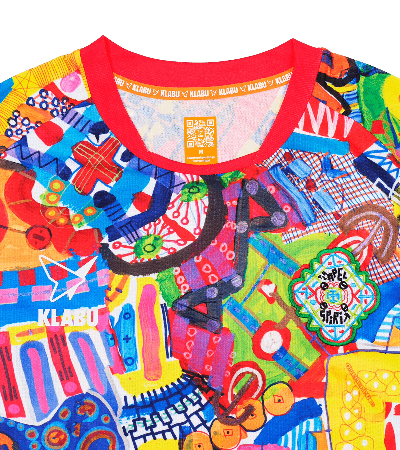 A vibrant, abstract T-shirt featuring a mix of colorful patterns, shapes, and symbols, with prominent reds, blues, yellows, and greens. Refugee sports sportswear impact