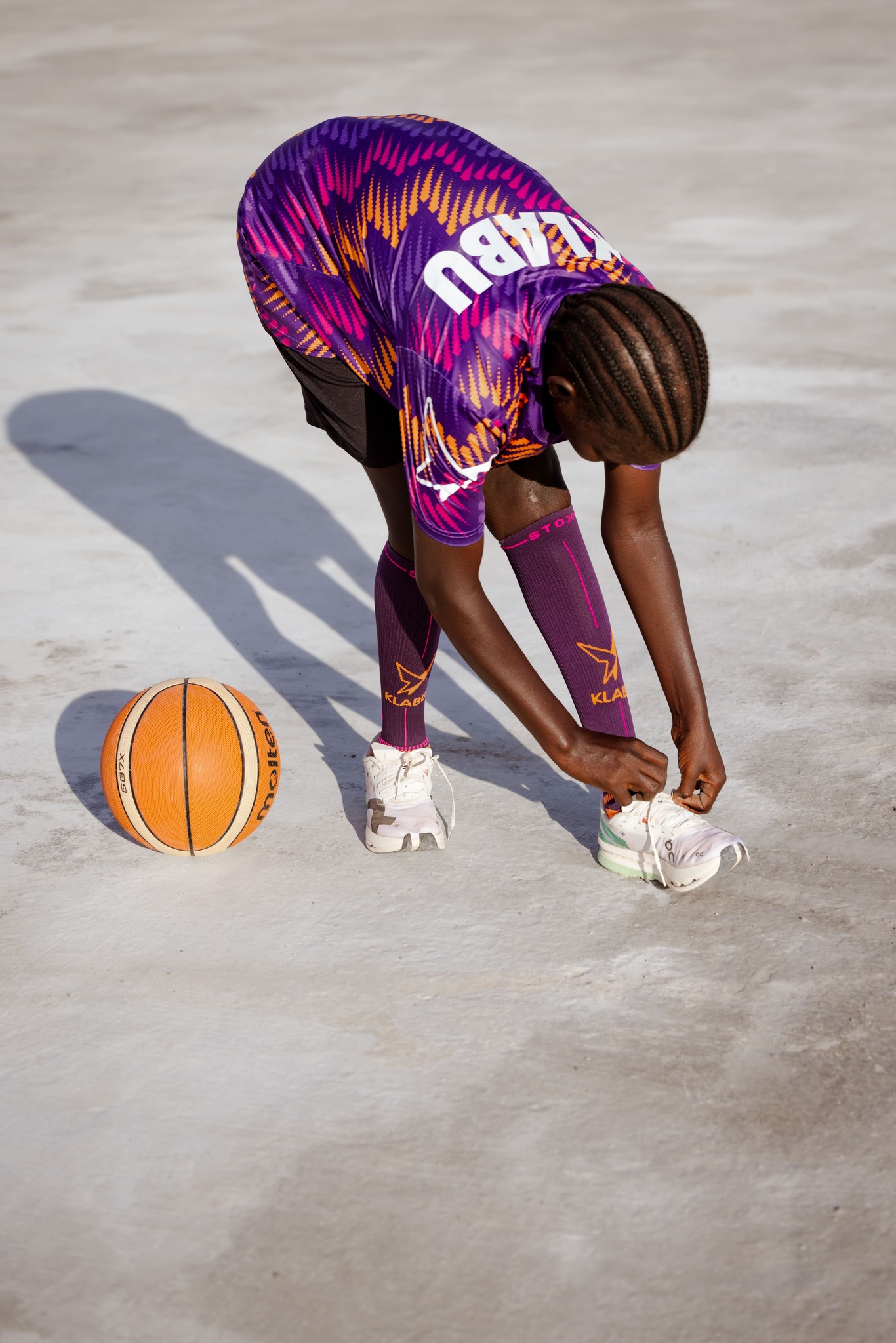 Helen plays basketball in Kalobeyei Refugee Settlement