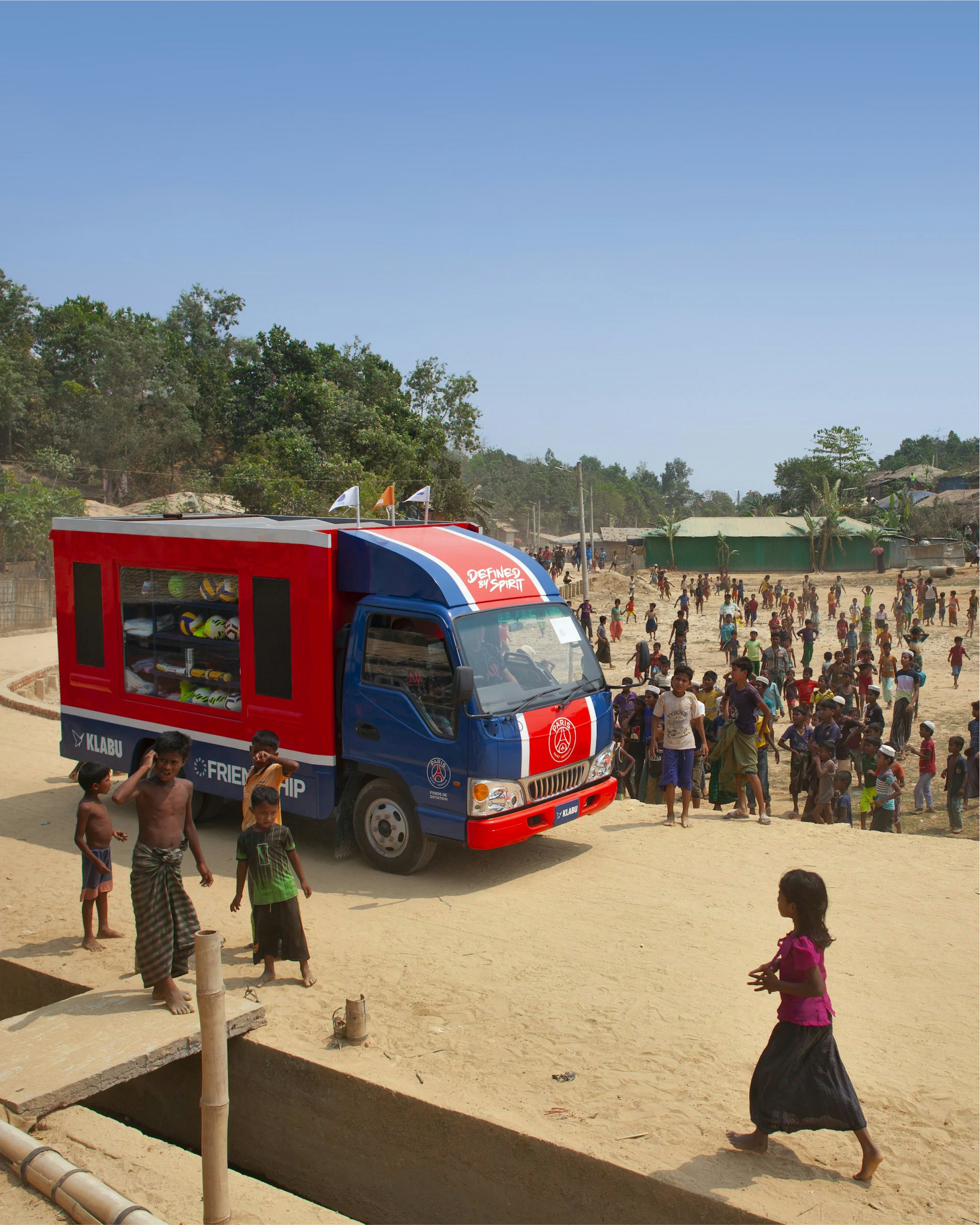 Mobile sports library surrounded by children in Cox's Bazar, Bangladesh